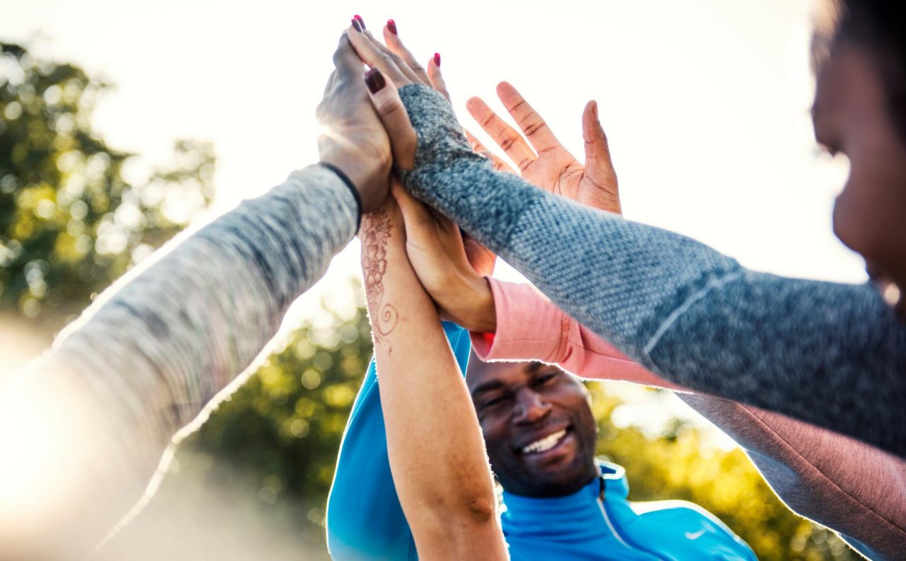 Team of people high fiving